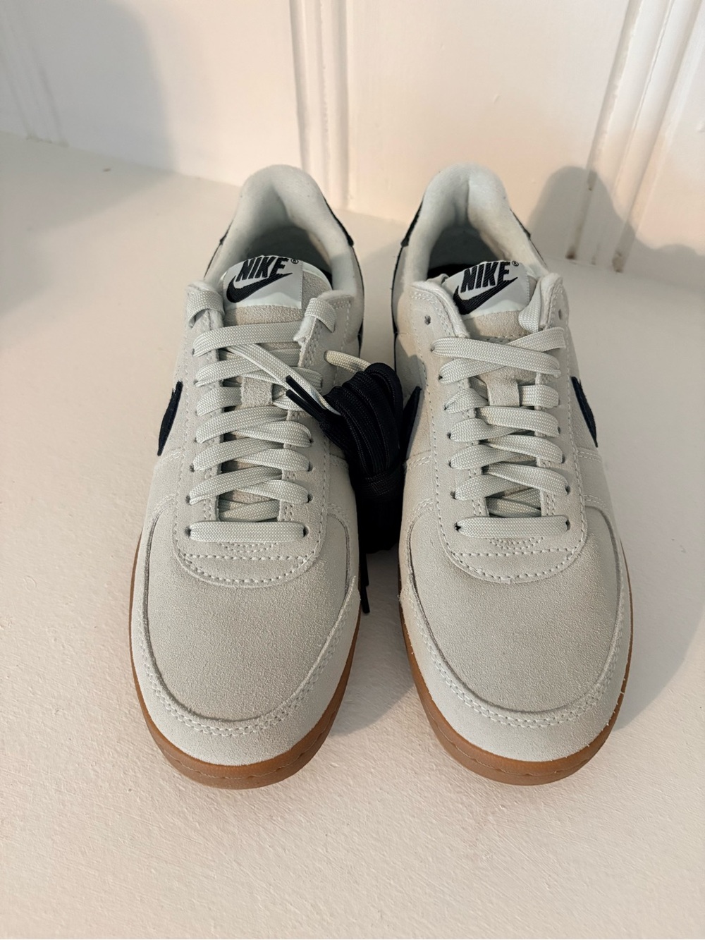 Nike Women’s Low-Top Sneakers in Light Gray with Black Swoosh and Gum Sole